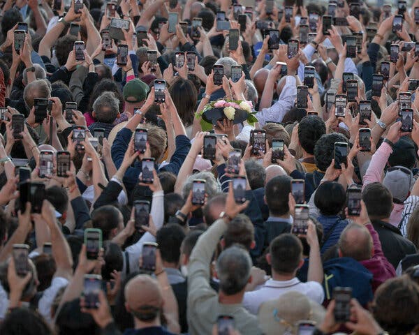 The crowd gathered as Pope Leo XIV appeared on the balcony of St. Peter's Basilica on Thursday.
