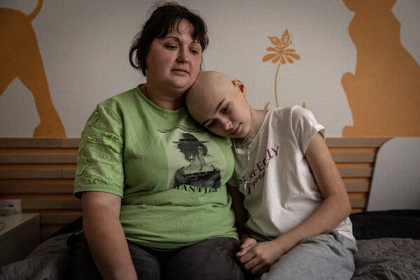 Twelve-year-old Margaryta Karpova and her mother, Liudmyla, photographed at a Kyiv hospital in December, where she has undergone six rounds of chemotherapy.