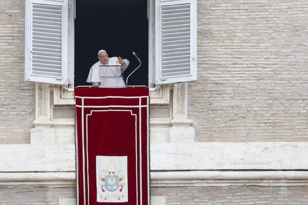 Pope Francis leads a prayer from the window of his office overlooking St. Peter’s Square in January.