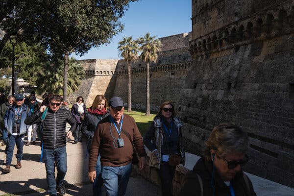 Tourists stroll past the 12th-century Castello Normanno-Svevo in Bari this year.