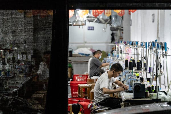 Night shift activity in Guangzhou’s garment manufacturing district.