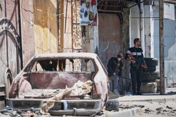 Members of Syria’s Druse minority guarding a checkpoint following sectarian clashes in a Damascus suburb with a significant Druse population.