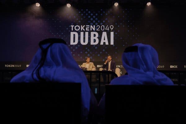 Eric Trump (right) and Zach Witkoff addressing attendees at a cryptocurrency conference in Dubai on Thursday.
