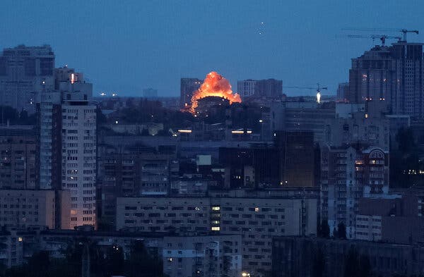 A drone explosion lights up the night during a Russian strike on Kyiv, Ukraine.