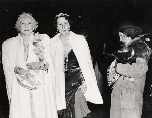 Weegee’s 1943 street photograph captures Mrs. George W. Kavenaugh and Lady Decies met with disdain from a passerby.