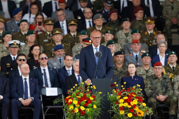 Chancellor Friedrich Merz addresses the crowd in Vilnius, Lithuania, at the launch ceremony of a German brigade stationed on NATO’s eastern frontier.