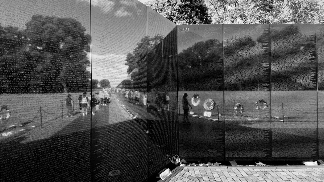 The memorial’s black granite stones bear the names of more than 58,000 servicemen and women who lost their lives in combat from 1958 to 1975.
