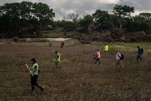 Search-and-rescue teams conducting operations Tuesday near Center Point, Texas.