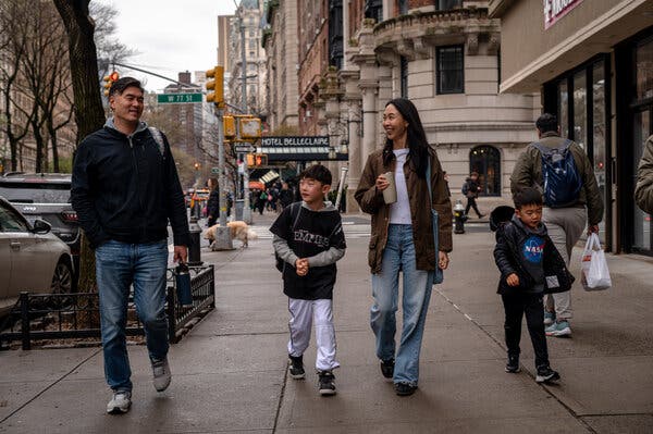 Sarah Paiji Yoo, second from right, leads Blueland, a company focused on sustainable cleaning products. She spends her Sunday with her husband Ken, left, and their sons Noah, 8, and Colin, 4.