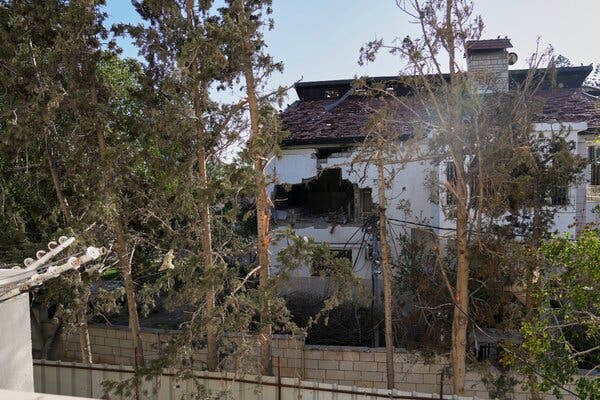 A projectile's impact is evident on the wall of the U.N. guesthouse struck by Israeli tank fire on March 19.