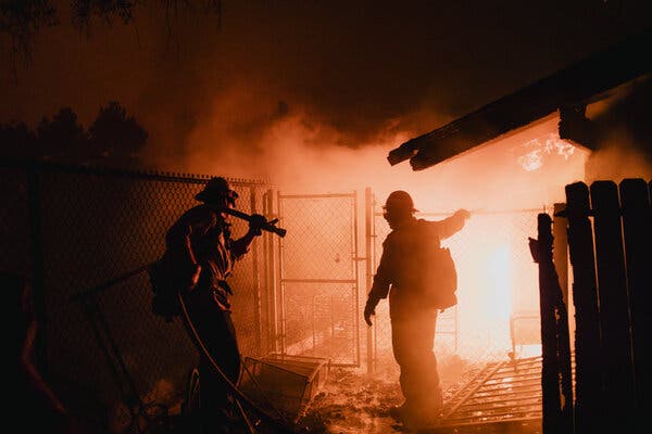 Firefighters combatting the wildfire in California’s Pacific Palisades neighborhood in January.