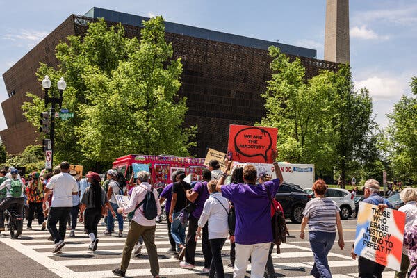 Activists rally in Washington to oppose perceived political interference at the National Museum of African American History and Culture.