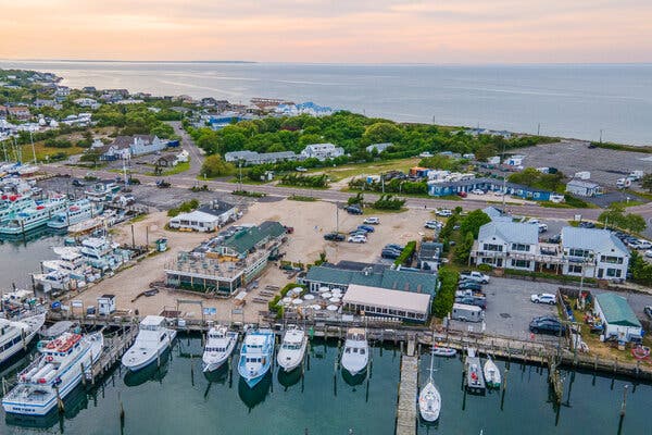 Mary Lou’s Montauk sits on a bustling harbor alongside other eateries, but its exclusive members-only feature raises concerns among locals.