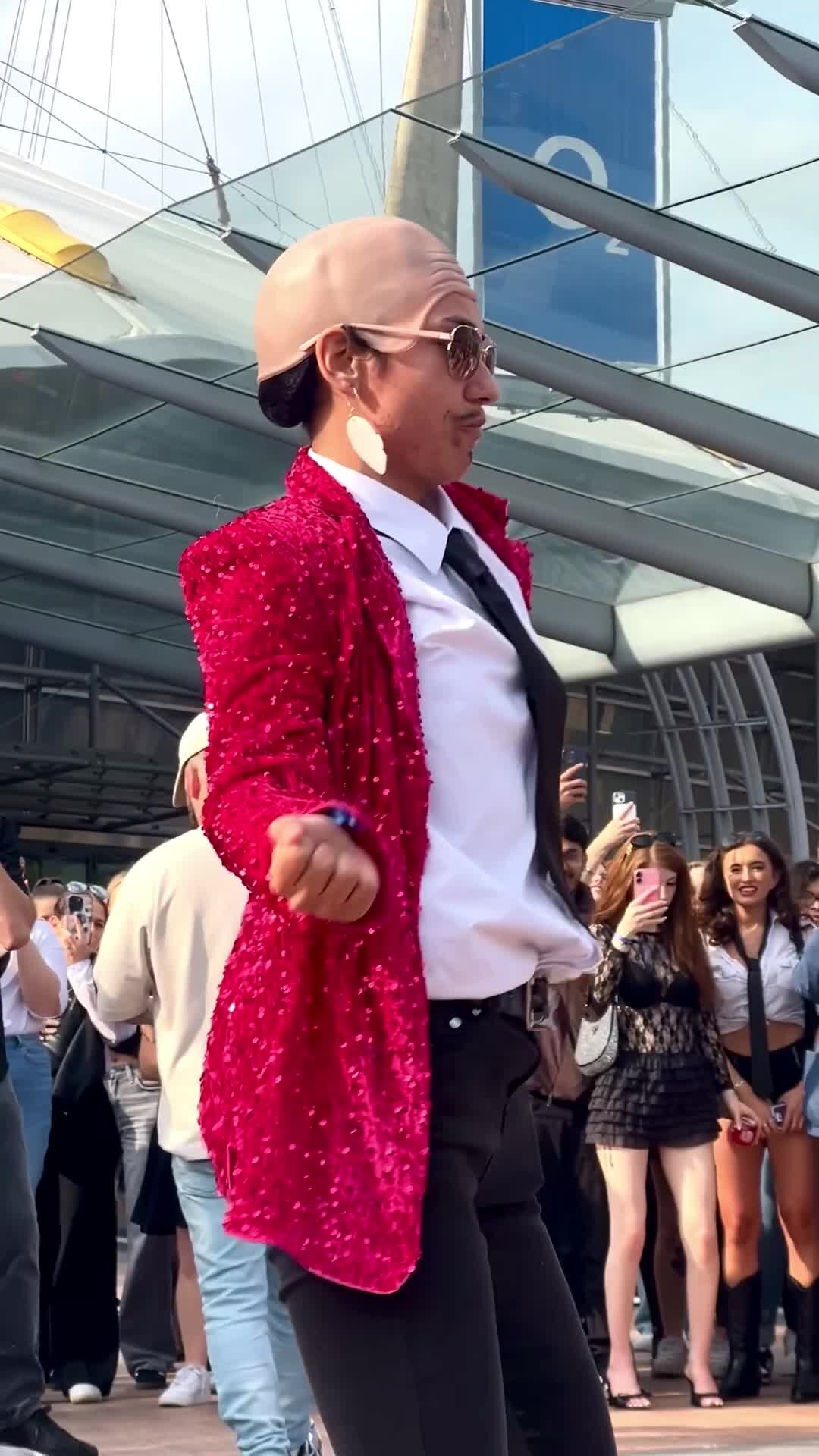 Pitbull's Bald Cap Craze Takes London Concertgoers by Storm