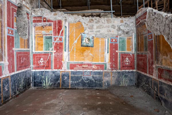 The vividly painted dining room of the House of Helle and Phrixus, a Pompeian home buried in 79 AD.