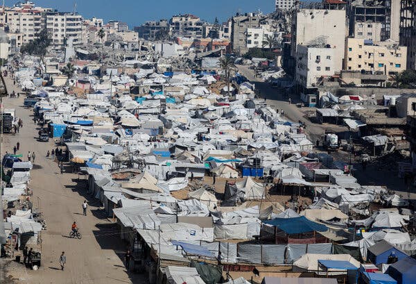 Palestinians displaced multiple times during the conflict seek refuge in Gaza City on Wednesday amid ongoing military operations.