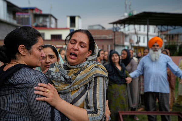 A woman mourning her husband who died during Pakistani shelling at his funeral in Poonch, Kashmir, under Indian administration.