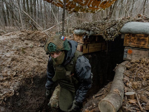 A Russian soldier positioned in a trench at an artillery site in the Kursk region during December.