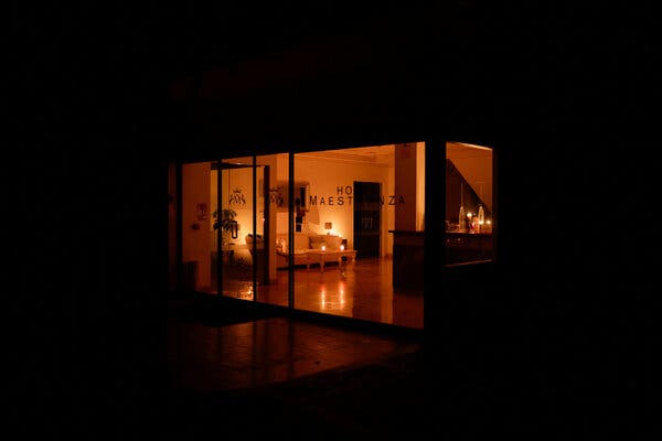 Candles illuminate the reception area of a hotel in Ronda, Spain, early Tuesday morning following a widespread blackout across the Iberian Peninsula.