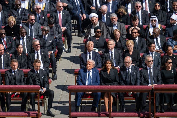 President Trump’s blue suit contrasted with the predominantly black attire of other dignitaries at the funeral.