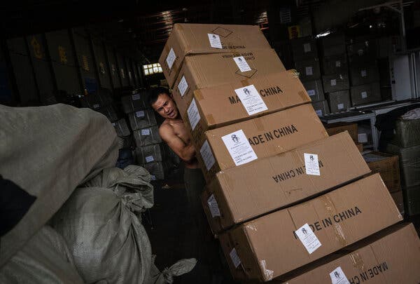 Goods destined for export are loaded into a shipping container at a logistics center in Yiwu, China. China has leveraged Vietnam and neighboring countries to circumvent U.S. tariffs on its products.