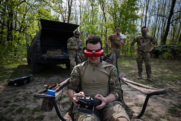 Operating a drone in Ukraine last week, the pilot experiences a first-person video perspective as bombs target Russian soldiers, vehicles, tanks, and bunkers.