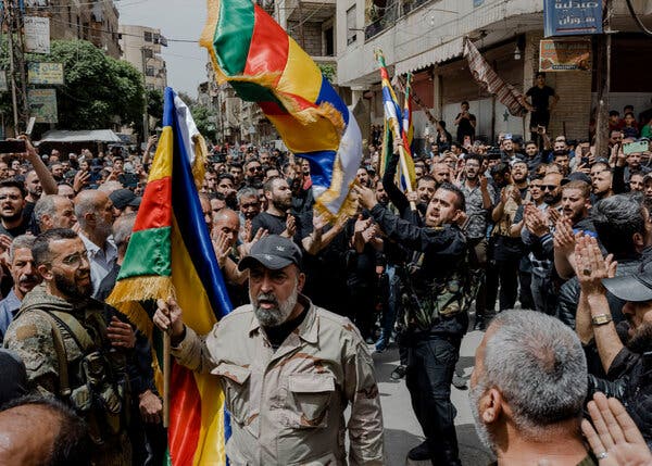 Funeral procession for Druse fighters killed in extremist attacks on neighborhoods near Damascus, home to a significant Druse population.