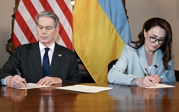 US Treasury Secretary Scott Bessent and Ukrainian Deputy Prime Minister Yulia Svyrydenko formalize the minerals sharing agreement.