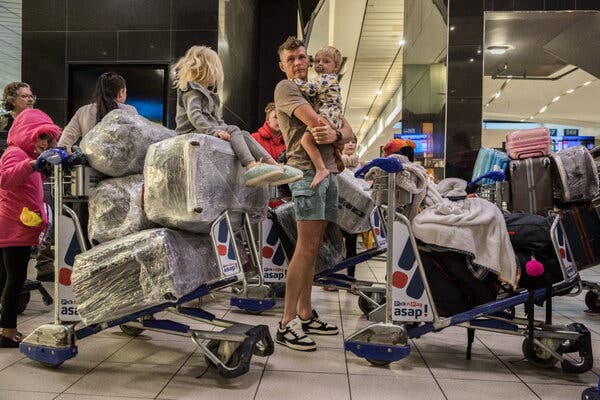 Afrikaner refugees check in for their flight to the United States at Johannesburg’s Or Tambo Airport, South Africa, on Sunday.